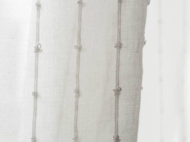 istock A close-up of a light translucent fabric that plays with the sun's rays, creating a feeling of lightness and airiness 2181199169