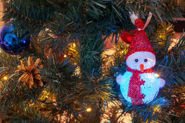 istock Colored Christmas decorations sparkle merrily on the Christmas tree, creating an atmosphere of magic and festive coziness 2181199813