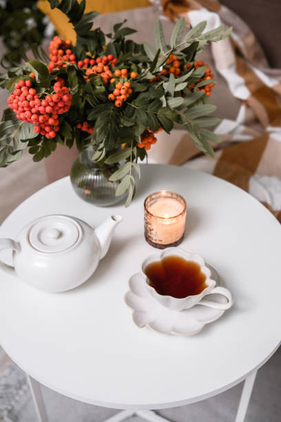 istock Experience a Cozy Tea Time surrounded by Beautiful Flowers and Soft Candlelight for Charm 2181201209