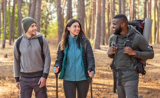 istock Multiracial group of hikers walking by forest 2181203697