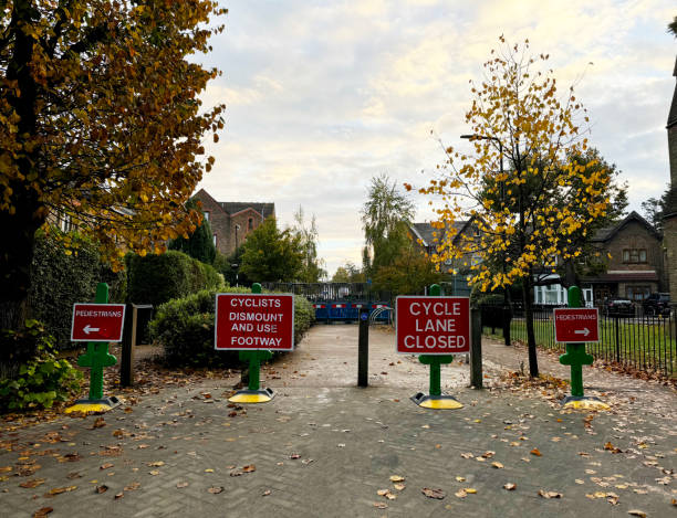 istock Cyclists dismount sign at road works 2181208919