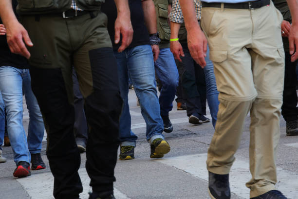 legs of people marching in a peaceful protest and strike