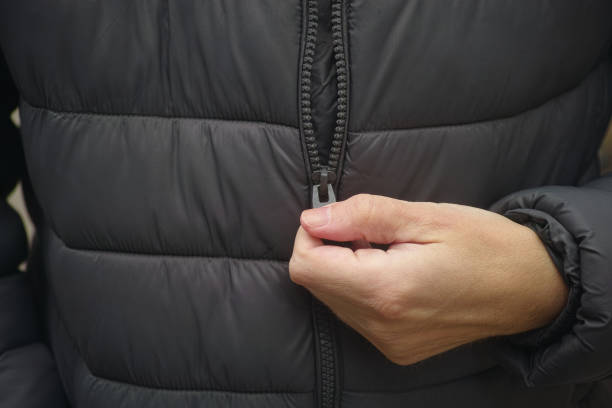 istock A man zipping up his puffer jacket. 2181212425