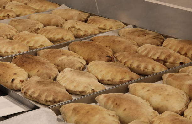 istock typical Italian dish called panzerotti which are small stuffed sandwiches cooked in a wood oven 2181214200