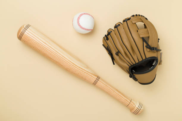 istock Baseball glove and bat with ball on color background, top view 2181214705