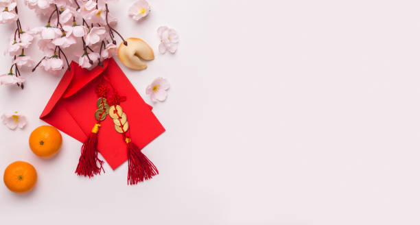 istock Sakura with mandarins and red envelopes with congratulations 2181214770