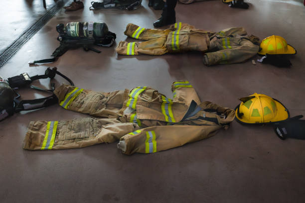 istock Firefighter Uniforms and Protection Laid Out on Fire Station Floor 2181220859