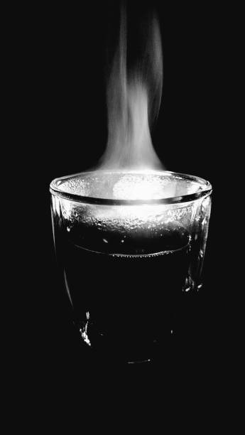 Hot coffee dances in gentle steam, smoke rising like a dream in flight.