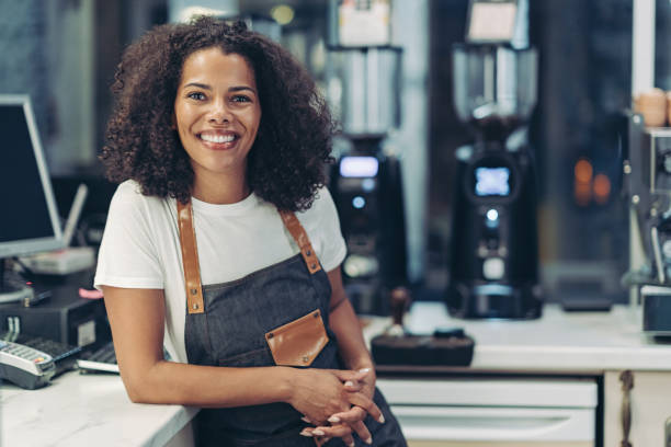 istock Happy barista standing at the counter 2181221951