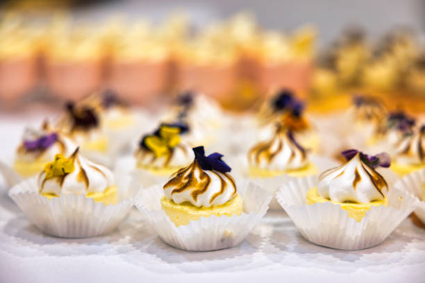 cake mini with edible flowers, patisserie lemon tart meringue,