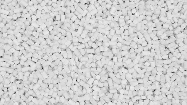 istock Closeup top view of white plastic polypropylene granules, masterbatch polymer grain. HDPE or PVC resin pellets. 3d render illustration 2181228845