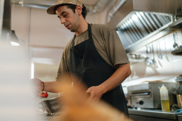 istock Chef prepares the food in a casual restaurant kitchen 2181231103