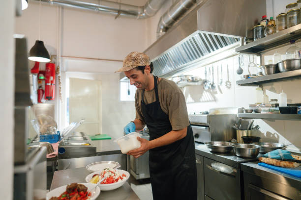 istock Chef prepares the food in a casual restaurant kitchen 2181231104