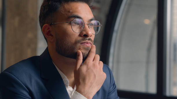 Thoughtful puzzled businessman Arabian Indian man thinking male guy employer worker think idea business plan strategy ponder consider doubt choose remember decide search deep thought question indoors Thoughtful puzzled businessman Arabian Indian man thinking male guy employer worker think idea business plan strategy ponder consider doubt choose remember decide search deep thought question indoors. High quality 4k footage deep pick stock pictures, royalty-free photos & images