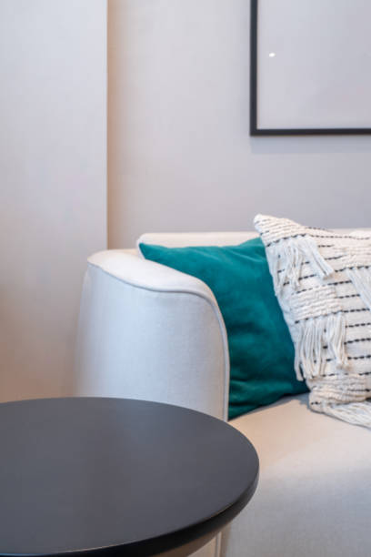 istock Part of sofa with cushions and a table on side 2181234820