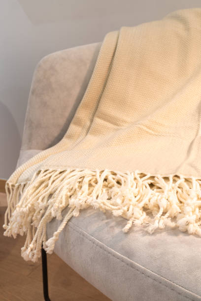 istock Close-up of a ecologic cotton blanket on a sofa 2181236194