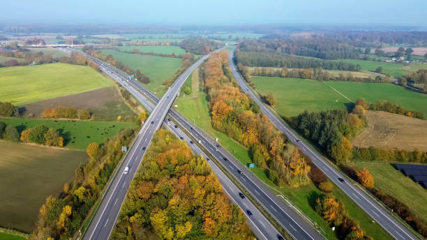 istock Aerial view on the A7 motorway in northern Germany between fields and meadows. 2181240232