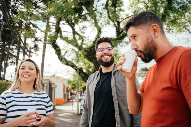 istock Three friends drinking espresso and chatting outdoors 2181245606