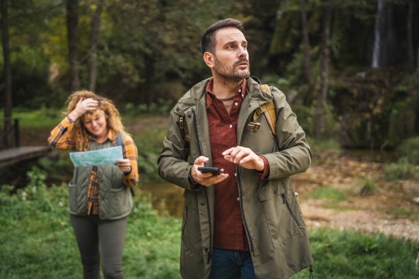 istock unhappy husband use mobile phone for help to try to found a route 2181249697