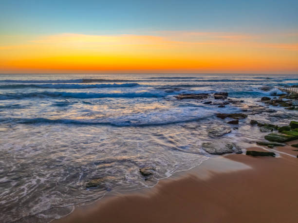 istock Sunrise at the Seaside with an Orange Horizon 2181249886