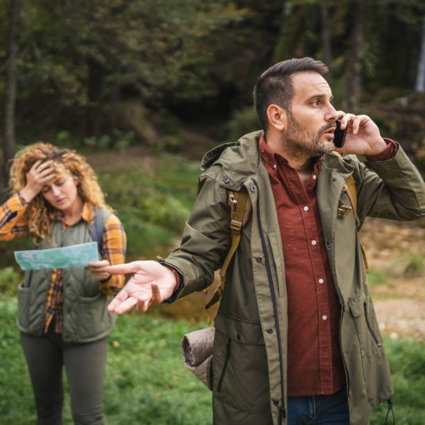 istock worried unhappy husband talk on mobile phone and try to found a route 2181250091