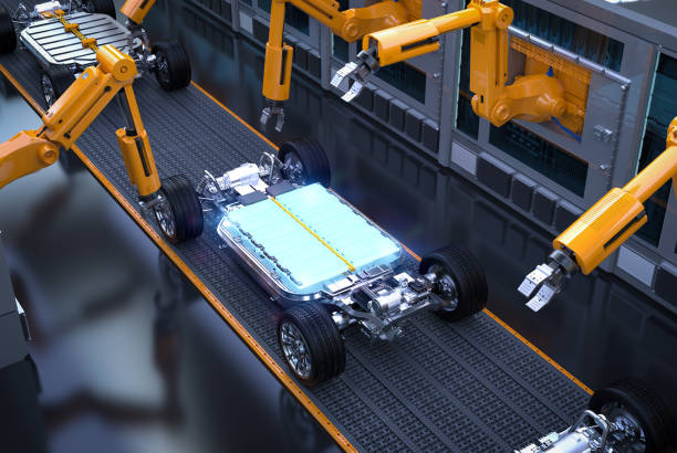 istock Robot assembly line with glowing ev car battery on undercarriage platform 2181250400