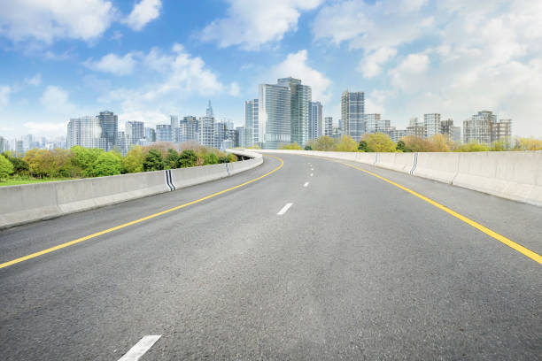 3d rendering smart city with empty road leading to high rise building cityscape