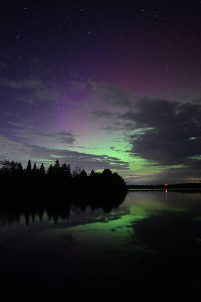 istock Northern Lights or Aurora Borielis reflecting over a remote lake 2181252070