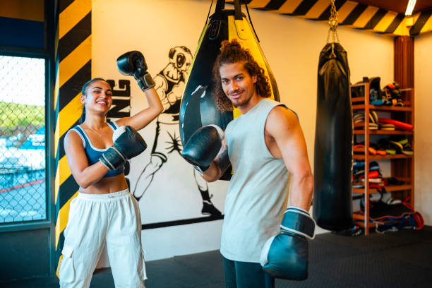 istock Happy Young Hispanic Couple Practicing Boxing Indoors 2181252453