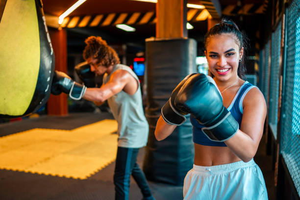istock Young Hispanic Female Enthusiastic During Boxing Practice 2181252457