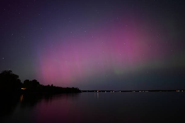 Northern Lights or Aurora Borielis reflecting over a remote lake