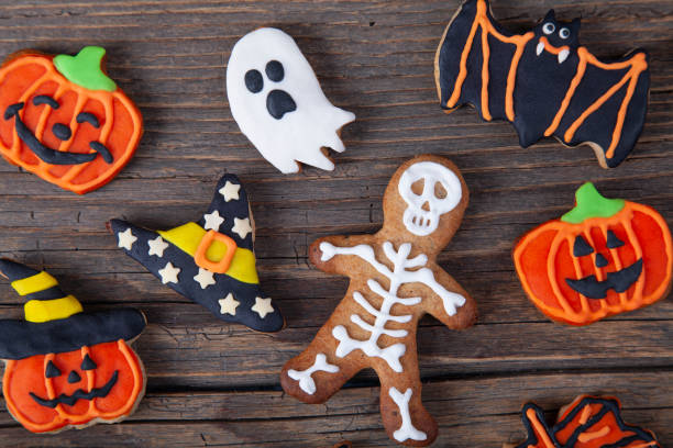 istock Halloween homemade gingerbread cookies on rustic wooden table 2181263409