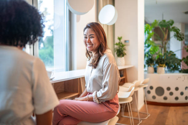 istock Diverse Businesswomen Engaged in Laptop Work at Office 2181263663