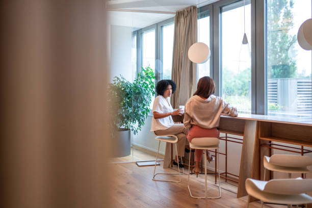 istock Diverse Businesswomen Collaborating Over Coffee in Office 2181263682