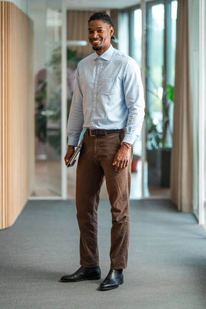 istock Confident Black Businessman with Digital Tablet in Office Corridor 2181263798