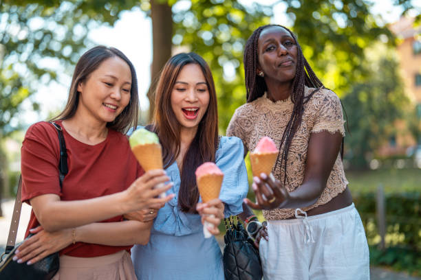 istock Diverse Friends Sharing Delight Over Ice Cream Treats 2181264282