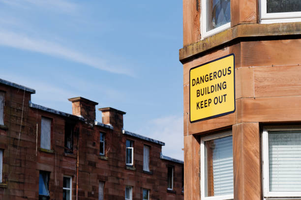 istock Dangerous building keep out sign on building ready to be demolished 2181265294