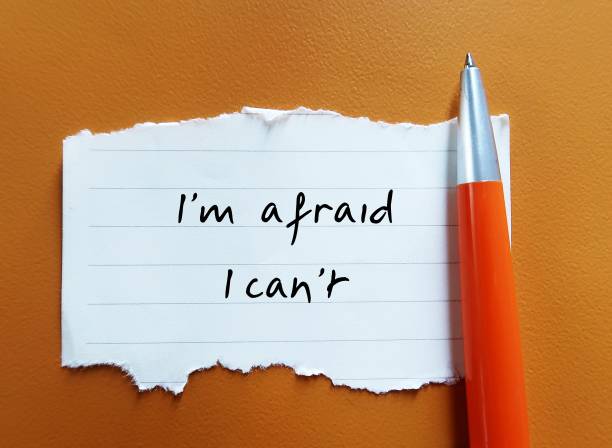 istock Torn note on orange background with handwritten text - I'm afraid I can't - different ways to say no - Learn to say no politely without feeling guilty 2181274132