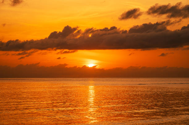 istock Sunrise over the tropical ocean with dramatic sky and clouds 2181276626