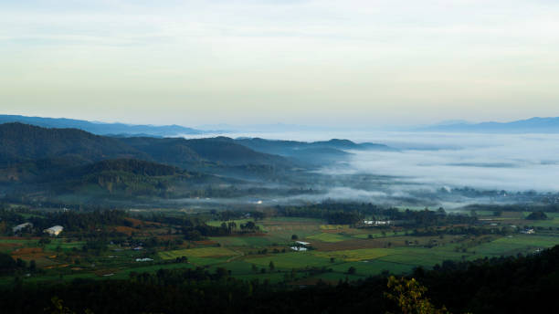 istock Village landscape covered with mist in the morning. 2181279650