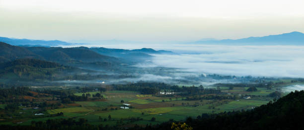 istock Village landscape covered with mist in the morning. 2181279652