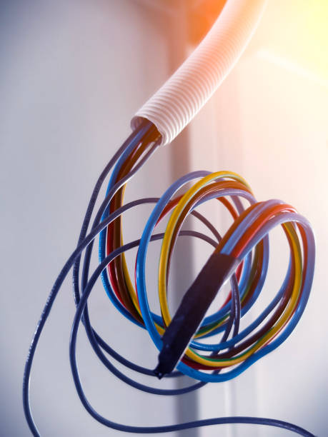 istock A collection of various wires is hanging down from the ceiling 2181282145