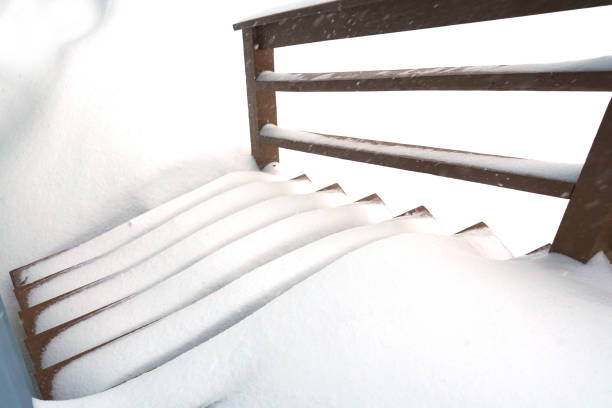 istock High angle view of wooden staircase covered by snow 2181284830