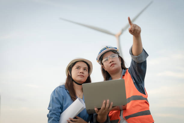 istock Two female engineers looking at laptops by one person pointing at something They are working on a project together. 2181285092