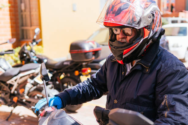 istock Elderly Man Preparing to Ride Motorcycle 2181287268