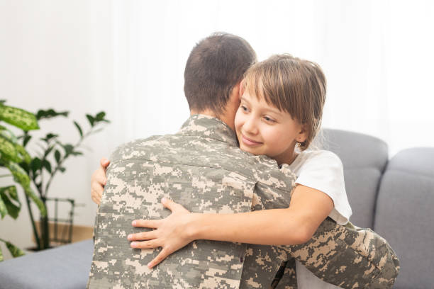 istock Military dad hugging his daughter 2181287918