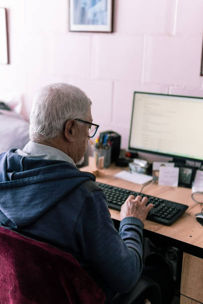 istock Senior man working on a computer at his desk 2181288431