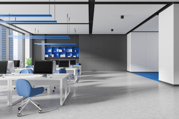 istock Modern open space office with blue accents and large windows. 3D Rendering 2181290443