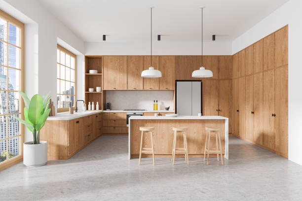 istock Stylish home kitchen interior with island and cooking cabinet, panoramic window 2181290508
