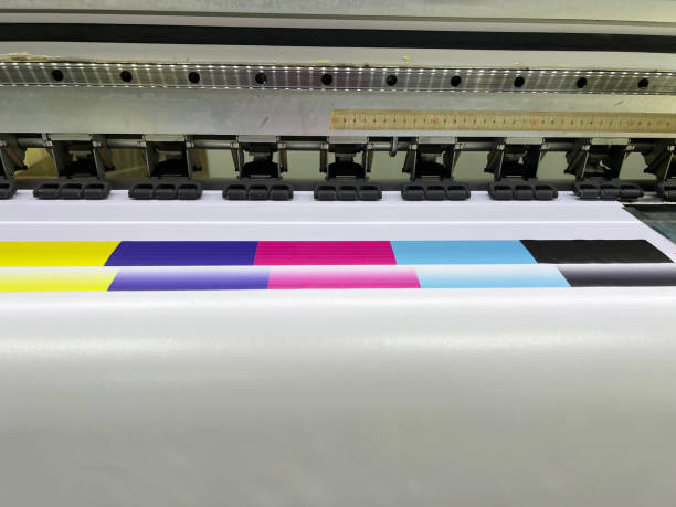 istock Close-up view of offset printing press rollers with vibrant CMYK color pattern,showcasing the technical aspects and precision of the prepress and printing production process. 2181297731